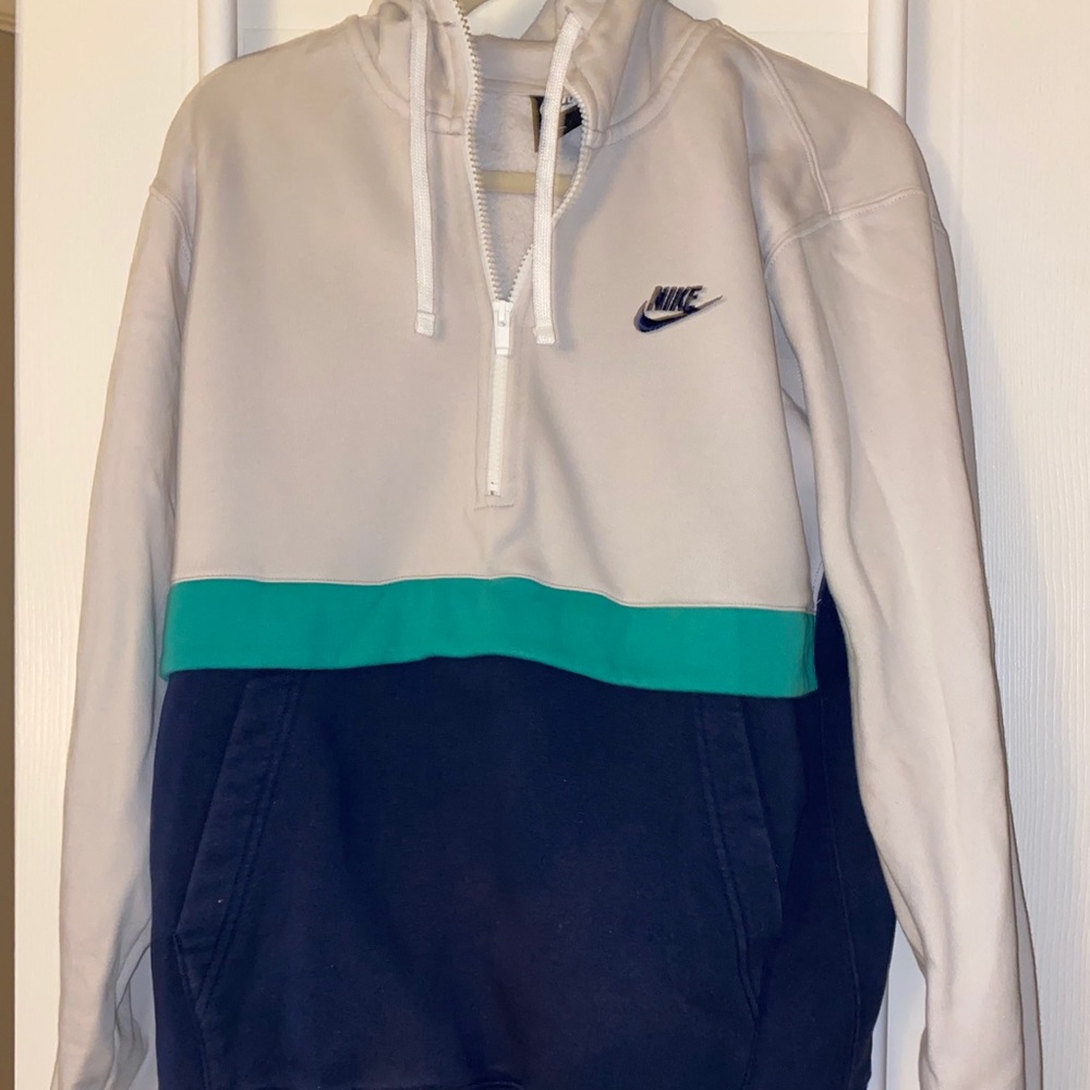 White, teal, and navy Nike hoodie and Nike lanyard